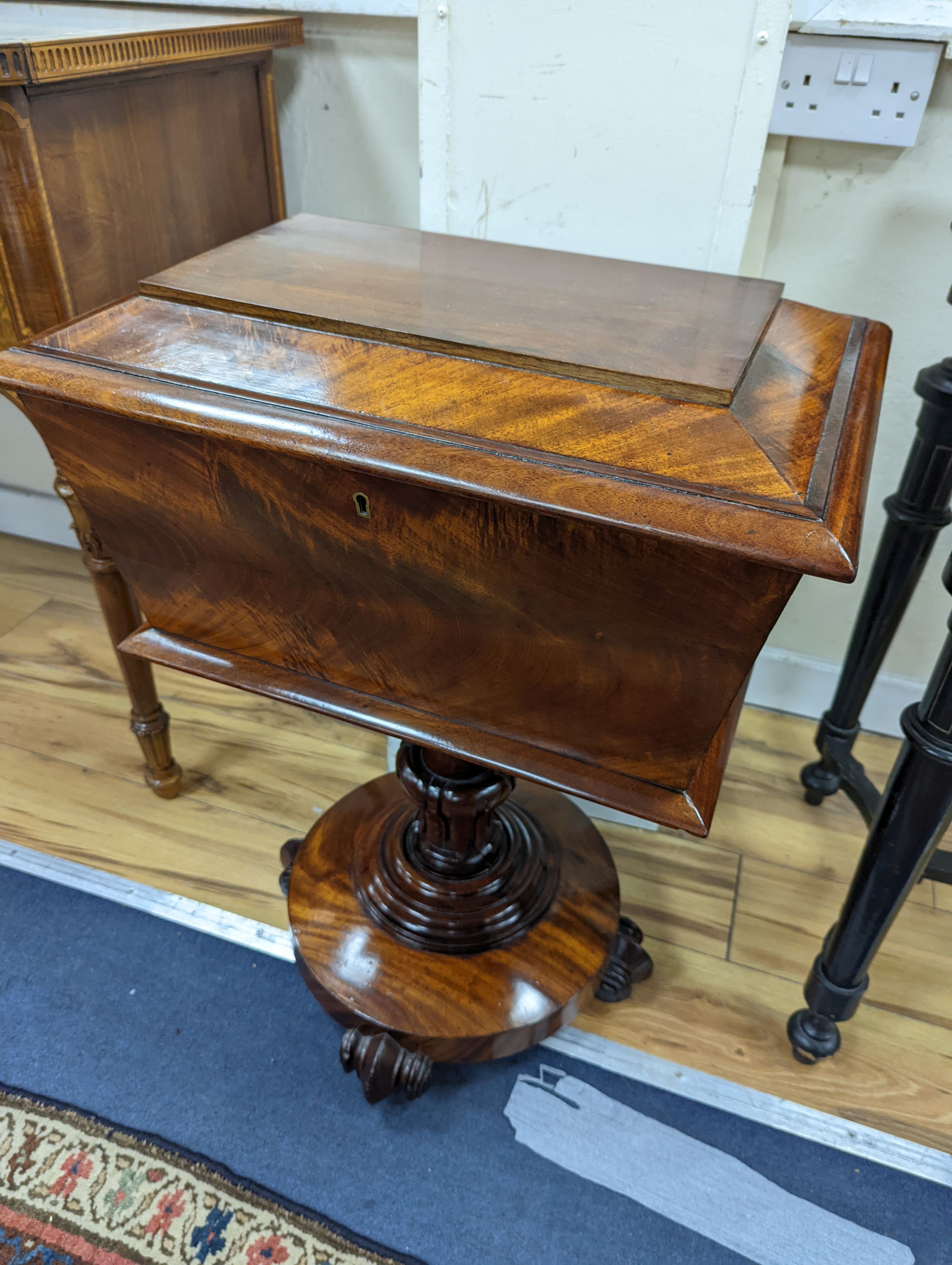 A mid Victorian sarchophagus shaped mahogany teapoy, width 52cm, depth 35cm, height 73cm